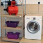 Einhell GC-WW 6538 sistema autoclave con pompa rossa e accessori su scaffale.