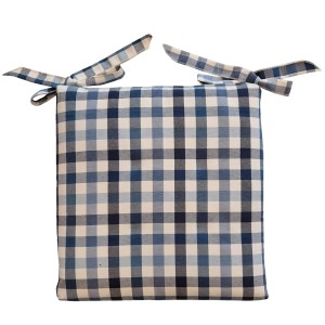 Cuscino per sedia a quadri blu e bianco con lacci.