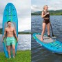 Set Bestway SUP Board Aqua Journey, blu/verde, con pagaia e persona sull'acqua.
