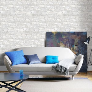 Soggiorno con piastrelle da rivestimento t.b.t. effetto pietra.