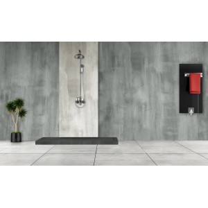 Bagno moderno con doccia, scaldasalviette e pianta su parete effetto cemento.