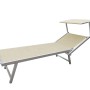 Lettino prendisole beige con tettuccio parasole per giardino e terrazza.
