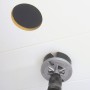 Set di seghe a tazza LUX in uso: Foratura di un foro in un soffitto bianco con un trapano.