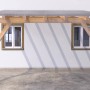 Struttura in legno con tetto trasparente, fissata con tasselli Fischer DuoXpand.