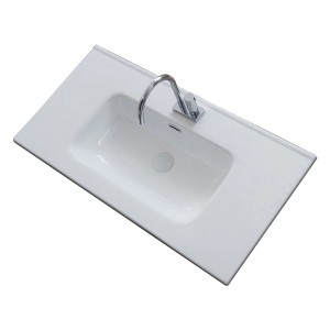 Lavabo da appoggio t.b.t. bianco con rubinetto, vista dall'alto.