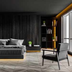 Camera da letto con illuminazione LED indiretta sotto letto e mobili.