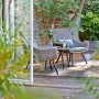 Set di mobili da balcone Aliceville a 3 pezzi in polyrattan verde-grigio con tavolo e sedie.