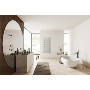 Bagno con radiatore t.b.t., mobile lavabo e vasca da bagno.