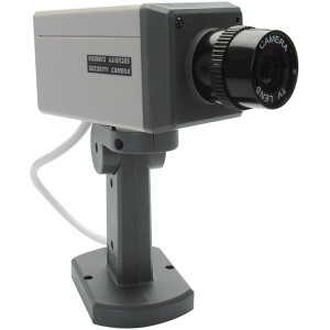 Telecamera di sicurezza fittizia grigia con lente nera per uso interno.