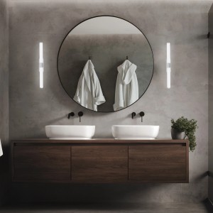 Scena bagno moderna con due applique LED t.b.t. che affiancano uno specchio rotondo.