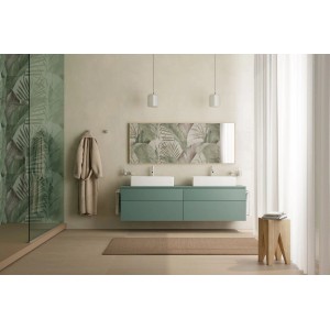 Bagno moderno con mobile lavabo verde, specchio e porta asciugamani.