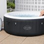 Bestway Lay-Z-Spa Miami AirJet: Vasca idromassaggio gonfiabile rotonda nera con pompa filtro e persona rilassante.