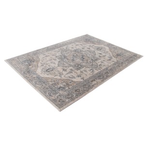 Tappeto vintage con motivo floreale in beige e grigio.