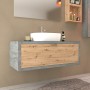 Mobile bagno moderno con lavabo e frontale in legno effetto cemento.
