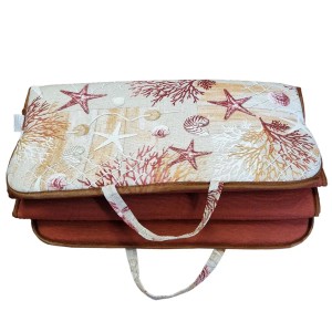 Cuscino da esterno t.b.t. con motivo a stelle marine e conchiglie.