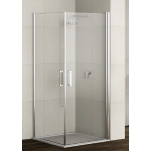 Box doccia angolare con pareti in vetro trasparente e profili argentati.