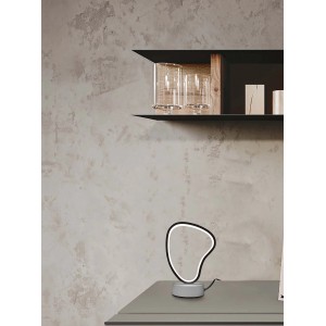 Moderna lampada da scrivania t.b.t. con forma insolita e illuminazione a LED.