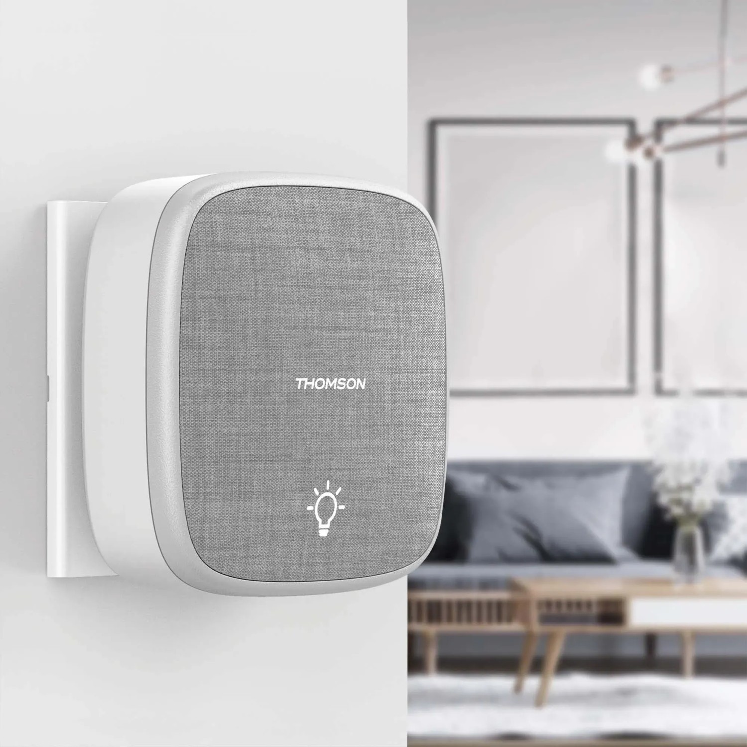 Thomson Campanelli: Campanello bianco con frontale in tessuto grigio e icona lampadina.