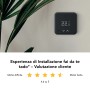 Kit tado° Termostato Intelligente V3+ nero su parete con pianta.