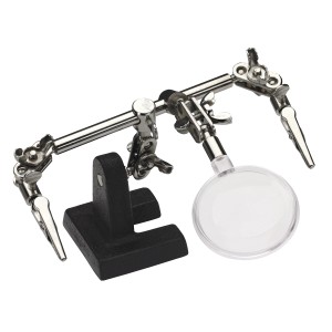 Supporto per saldatura LUX con lente d'ingrandimento: supporto con morsetti e lente d'ingrandimento per saldature precise.
