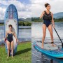 Set tavola SUP Bestway Oceana con sedile, 305 cm, con pagaia, pompa e zaino. Donna che rema e a riva.
