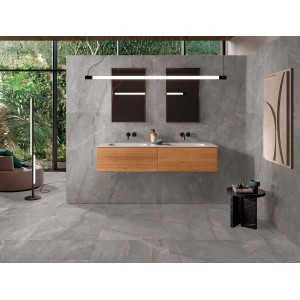 Bagno con piastrelle per pavimenti grigie. Design moderno.