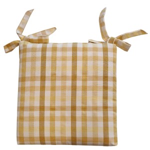 Cuscino per sedia a quadri giallo e bianco con lacci.