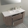 Mobile bagno t.b.t. con lavabo bianco e frontali effetto legno.