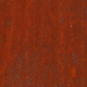 Primo piano di una pittura per esterni t.b.t. marrone-rossiccio con una leggera texture.