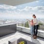 Biohort Stylebox 140 in grigio scuro metallizzato su terrazza con famiglia e bolle di sapone.