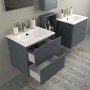Mobile bagno grigio con cassetti bianchi, parte della serie di arredo bagno.