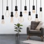 Lampadine LED E27 decorative in varie forme, sospese davanti a uno sfondo di soggiorno.