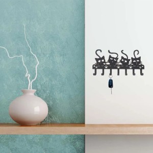 Appendiabiti da parete a forma di gatto nero con chiave.