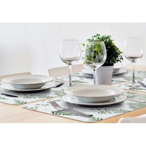 Tavola apparecchiata con tovagliette t.b.t. con motivo felce.