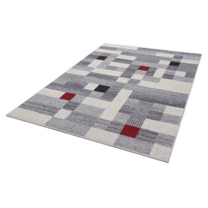 Tappeto moderno con motivo geometrico nei toni del grigio, bianco e rosso.