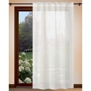 Tenda trasparente bianca t.b.t. con piccoli pois davanti alla finestra.