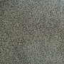 Piastrella per pavimenti in PVC grigio con motivo screziato.