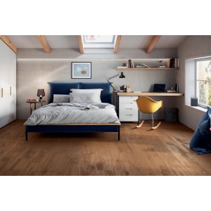 Motivo di piastrelle per pavimenti posate in camera da letto con letto e scrivania.