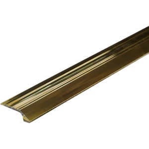Dettaglio di un profilo t.b.t. color oro per pavimenti.