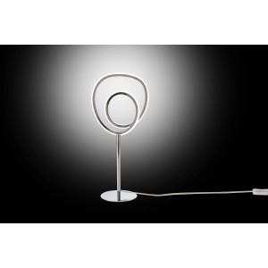 Moderna lampada da tavolo t.b.t. con cerchi LED e base cromata.