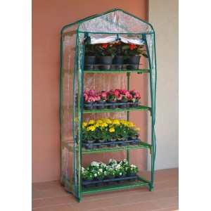 Piccola serra verde con quattro ripiani pieni di fiori.