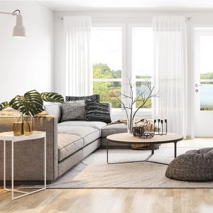 Soggiorno con divano grigio, tavolo in legno e pareti bianche. Pittura per interni per un ambiente luminoso.