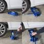 Cric auto blu t.b.t. in uso sotto un'auto bianca.