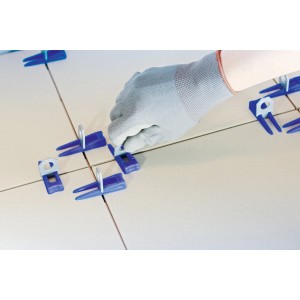 Set di livellamento LUX con cunei e clip per la posa delle piastrelle.