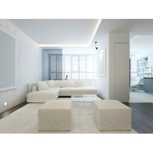 Soggiorno luminoso con illuminazione indiretta e lampadine LED.