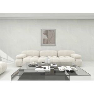 Soggiorno con rivestimento murale t.b.t. bianco, abbinato a divano moderno e tavolino in vetro.