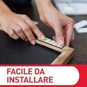 Fissaggio di un gancio per quadri t.b.t. a una cornice di legno. Ganci per quadri.