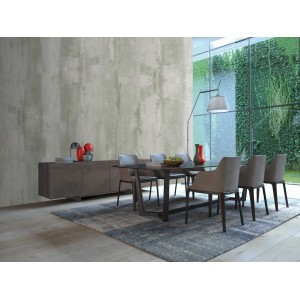 Sala da pranzo moderna con pareti effetto cemento e mobili coordinati.