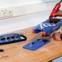 Einhell TC-MG 135 E utensile per levigatura e incisione in uso con accessori e valigetta.