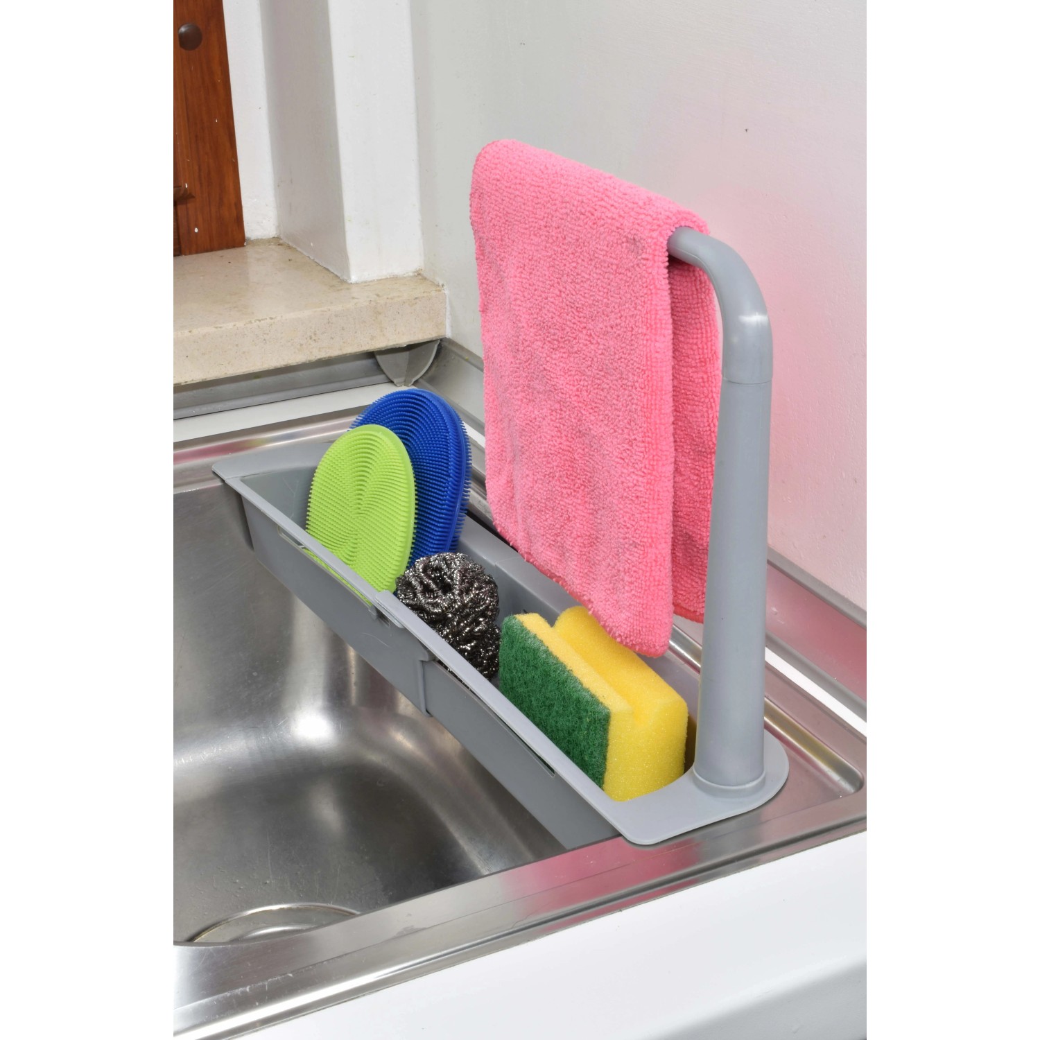 Organizzatore per lavello con spugna, strofinaccio e spazzole per la cucina.